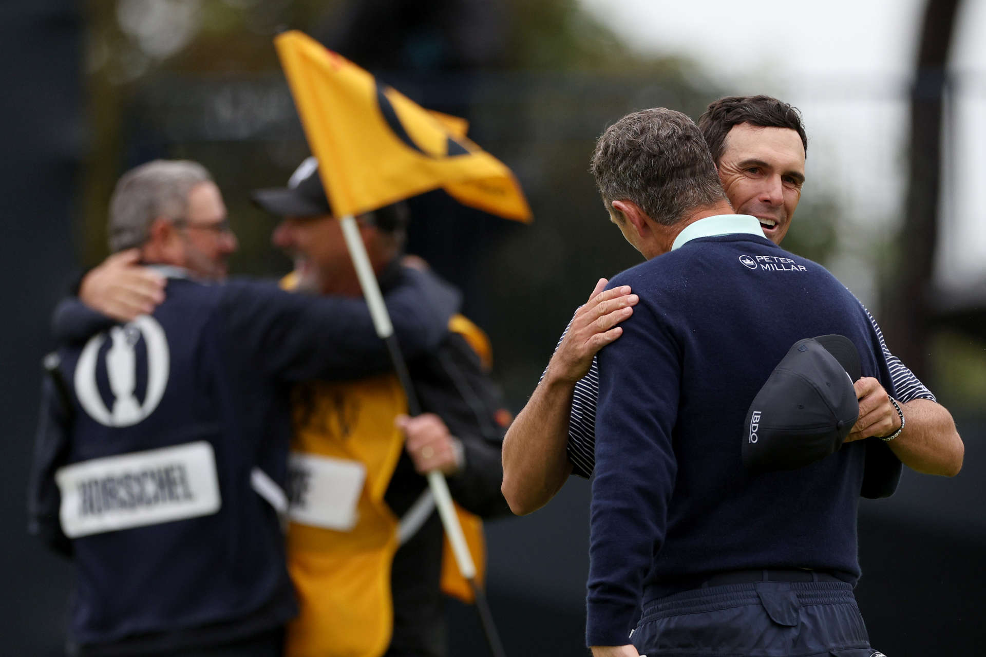 TROON, SCOTLAND - JULY 20: Justin Rose of England and Billy Horschel of the United States embrace after finishing their round on the 18th green during day three of The 152nd Open championship at Royal Troon on July 20, 2024 in Troon, Scotland. (Photo by Harry How/Getty Images)