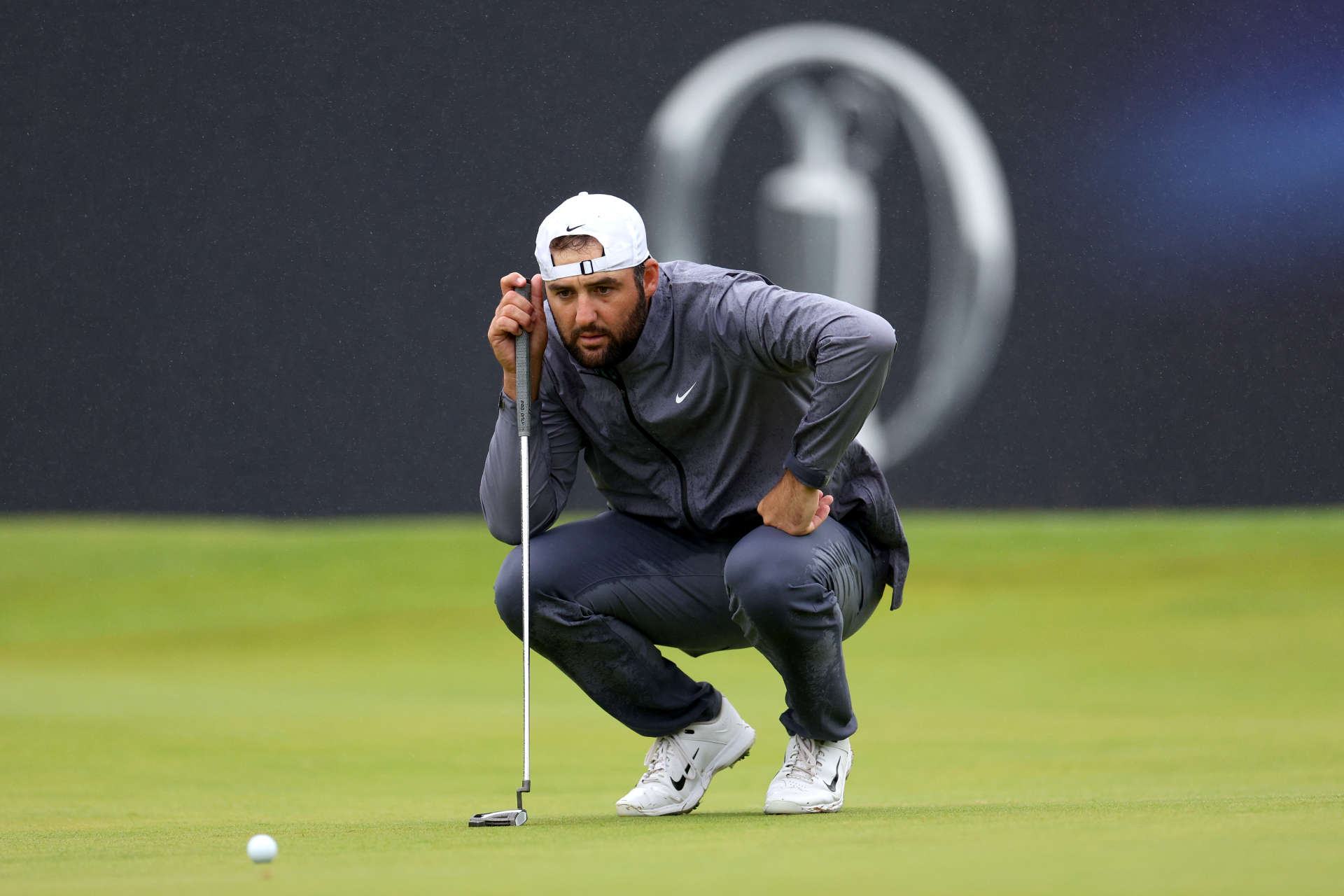 TROON, SCOTLAND - JULY 20: Scottie Scheffler of the United States lines up a putt on the 18th green during day three of The 152nd Open championship at Royal Troon on July 20, 2024 in Troon, Scotland. (Photo by Harry How/Getty Images)