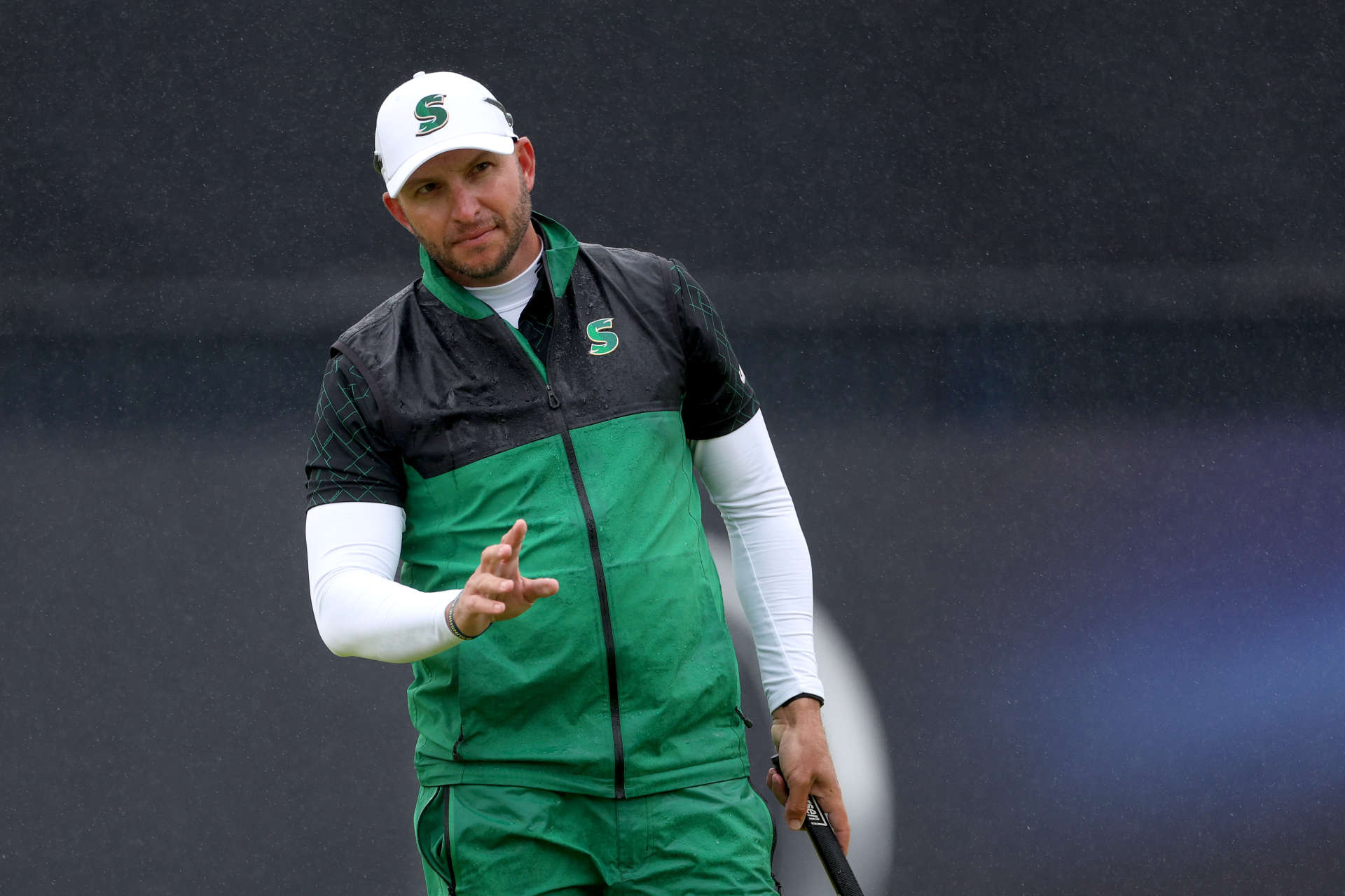 TROON, SCOTLAND - JULY 20: Dean Burmester of South Africa acknowledges the crowd on the 18th green during day three of The 152nd Open championship at Royal Troon on July 20, 2024 in Troon, Scotland. (Photo by Harry How/Getty Images)