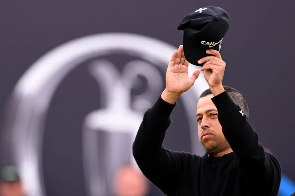 TROON, SCOTLAND - JULY 21: Xander Schauffele of the United States acknowledges the crowd on the 18th green during day four of The 152nd Open championship at Royal Troon on July 21, 2024 in Troon, Scotland. (Photo by Ross Kinnaird/Getty Images)