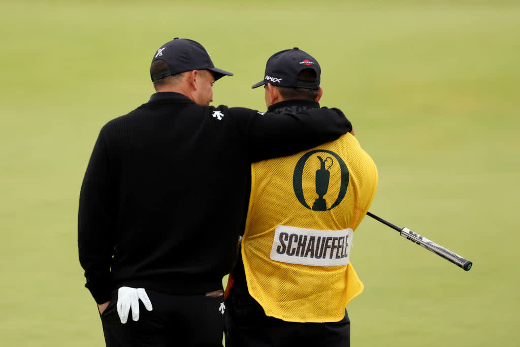 TROON, SCOTLAND - JULY 21: Xander Schauffele of the United States celebrates with his caddie Austin Kaiser on the 18th green during day four of The 152nd Open championship at Royal Troon on July 21, 2024 in Troon, Scotland. (Photo by Kevin C. Cox/Getty Images)