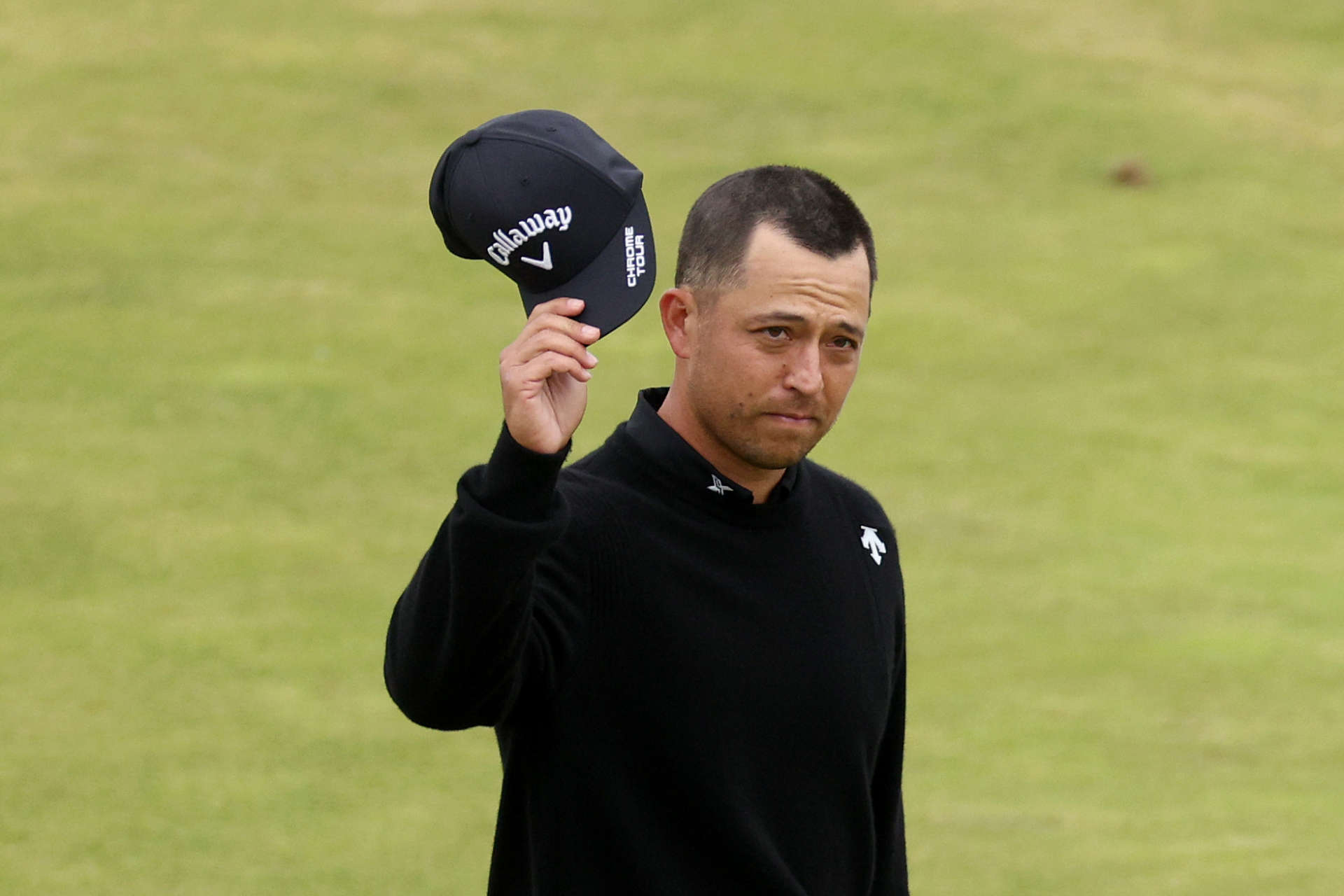 TROON, SCOTLAND - JULY 21: Xander Schauffele of the United States acknowledges the crowd on the 18th green during day four of The 152nd Open championship at Royal Troon on July 21, 2024 in Troon, Scotland. (Photo by Warren Little/Getty Images)