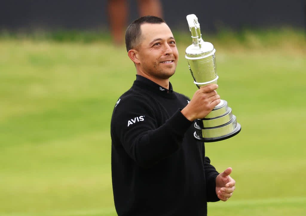 TROON, SCOTLAND - JULY 21: Xander Schauffele of the United States holds the Claret Jug on the 18th green in celebration of victory during day four of The 152nd Open championship at Royal Troon on July 21, 2024 in Troon, Scotland. (Photo by Kevin C. Cox/Getty Images)