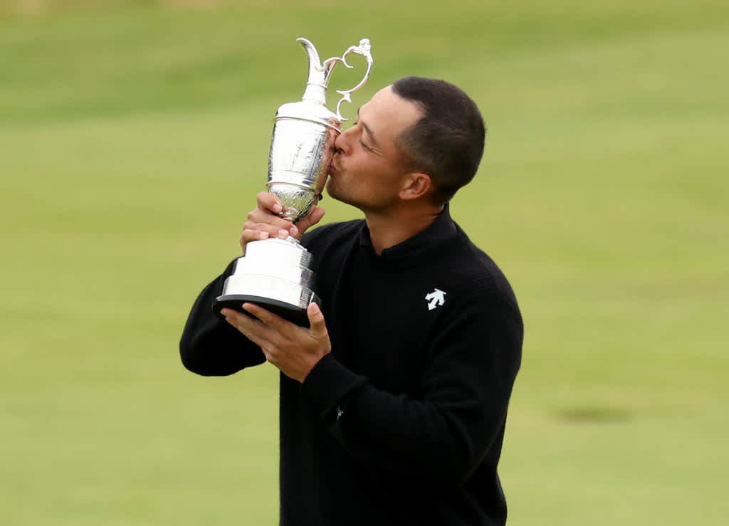 TROON, SCOTLAND - JULY 21: Xander Schauffele of the United States poses with the Claret Jug on the 18th green in celebration of victory during day four of The 152nd Open championship at Royal Troon on July 21, 2024 in Troon, Scotland. (Photo by Kevin C. Cox/Getty Images)