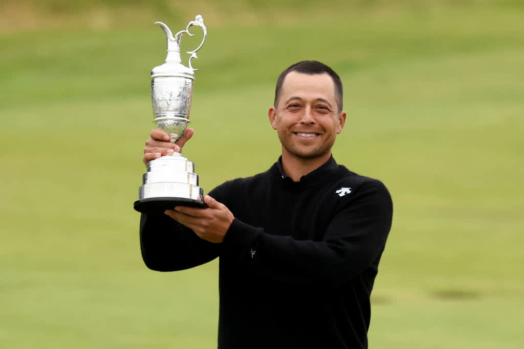 TROON, SCOTLAND - JULY 21: Xander Schauffele of the United States poses with the Claret Jug on the 18th green in celebration of victory during day four of The 152nd Open championship at Royal Troon on July 21, 2024 in Troon, Scotland. (Photo by Kevin C. Cox/Getty Images)