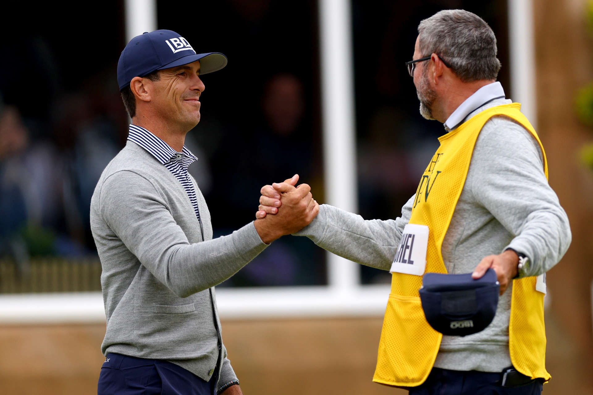 TROON, SCOTLAND - JULY 21: Billy Horschel of the United States shakes hands with his caddie Micah Fugitt on the 18th green during day four of The 152nd Open championship at Royal Troon on July 21, 2024 in Troon, Scotland. (Photo by Andrew Redington/Getty Images)