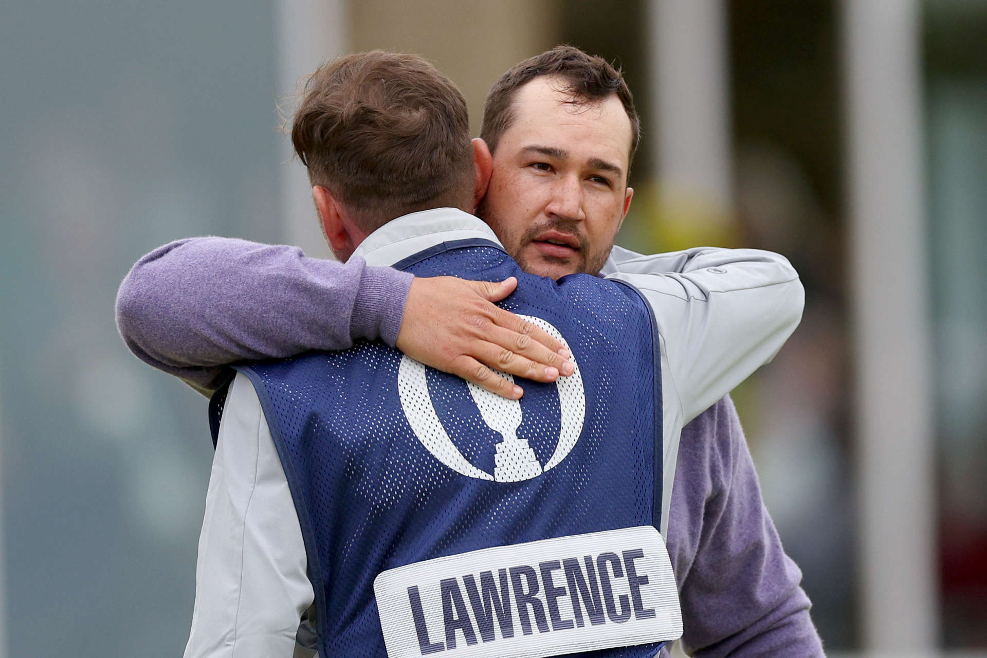 TROON, SCOTLAND - JULY 21: Thriston Lawrence of South Africa embraces his caddie Theunis Bezuidenhout after finishing his round on the 18th green during day four of The 152nd Open championship at Royal Troon on July 21, 2024 in Troon, Scotland. (Photo by Andrew Redington/Getty Images)