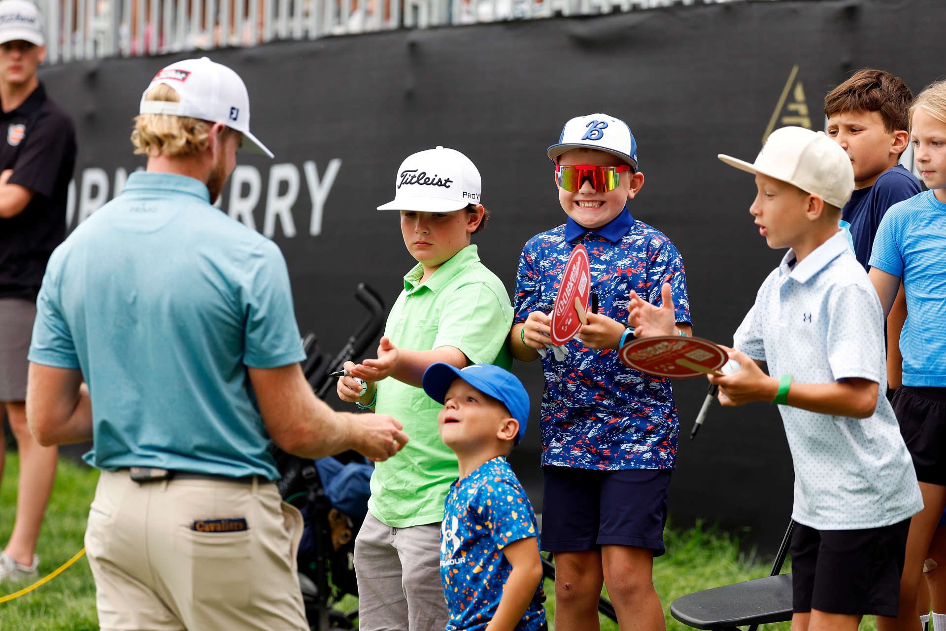 OMAHA, NEBRASKA - AUGUST 10: A fan reacts to receiving a glove used by Danny Walker of the United States on the 18th hole during the third round of the Pinnacle Bank Championship presented by Woodhouse at The Club at Indian Creek on August 10, 2024 in Omaha, Nebraska. (Photo by David Berding/Getty Images)