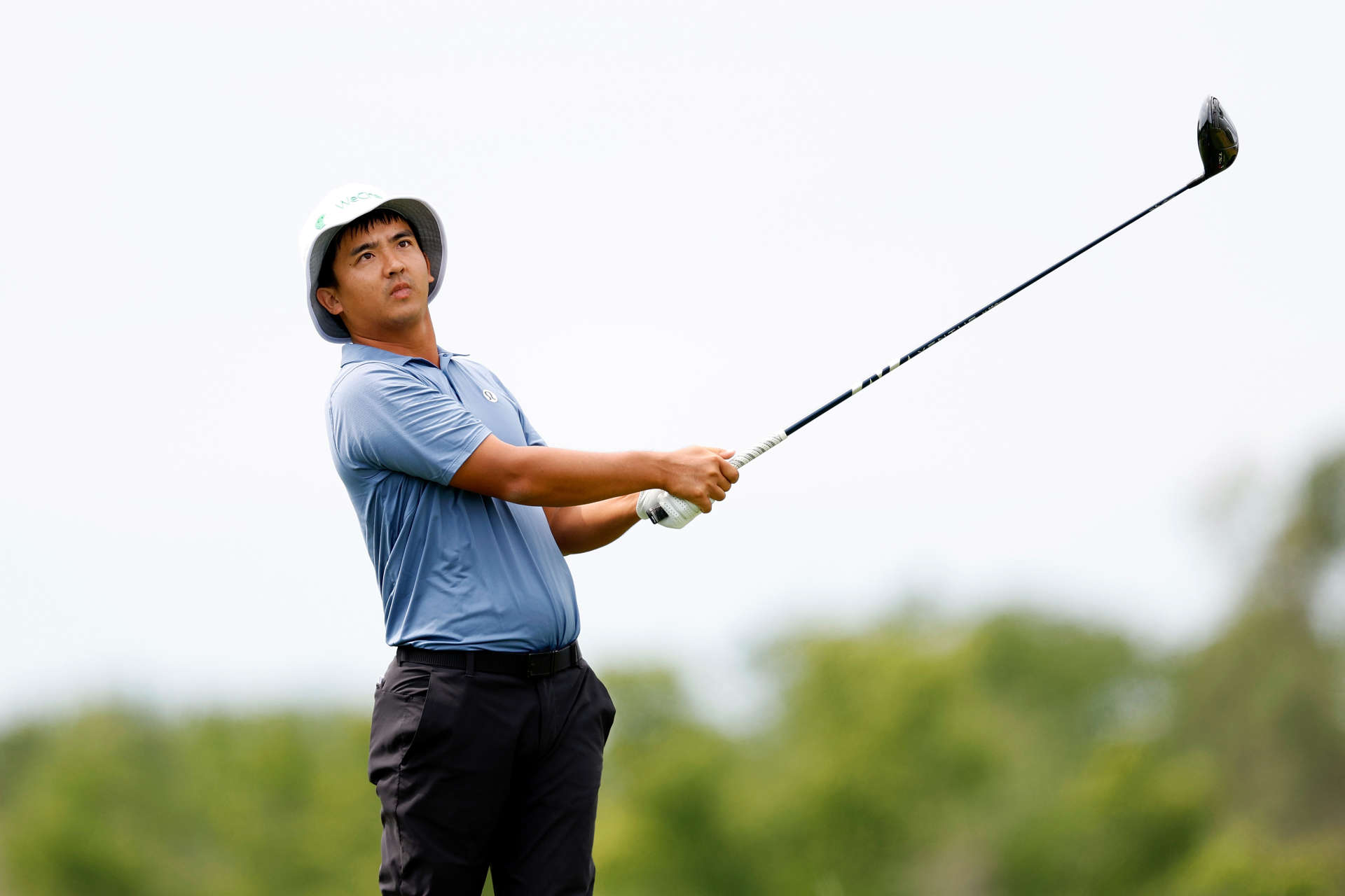 OMAHA, NEBRASKA - AUGUST 10: Zecheng Dou of China plays his tee shot on the third hole during the third round of the Pinnacle Bank Championship presented by Woodhouse at The Club at Indian Creek on August 10, 2024 in Omaha, Nebraska. (Photo by David Berding/Getty Images)