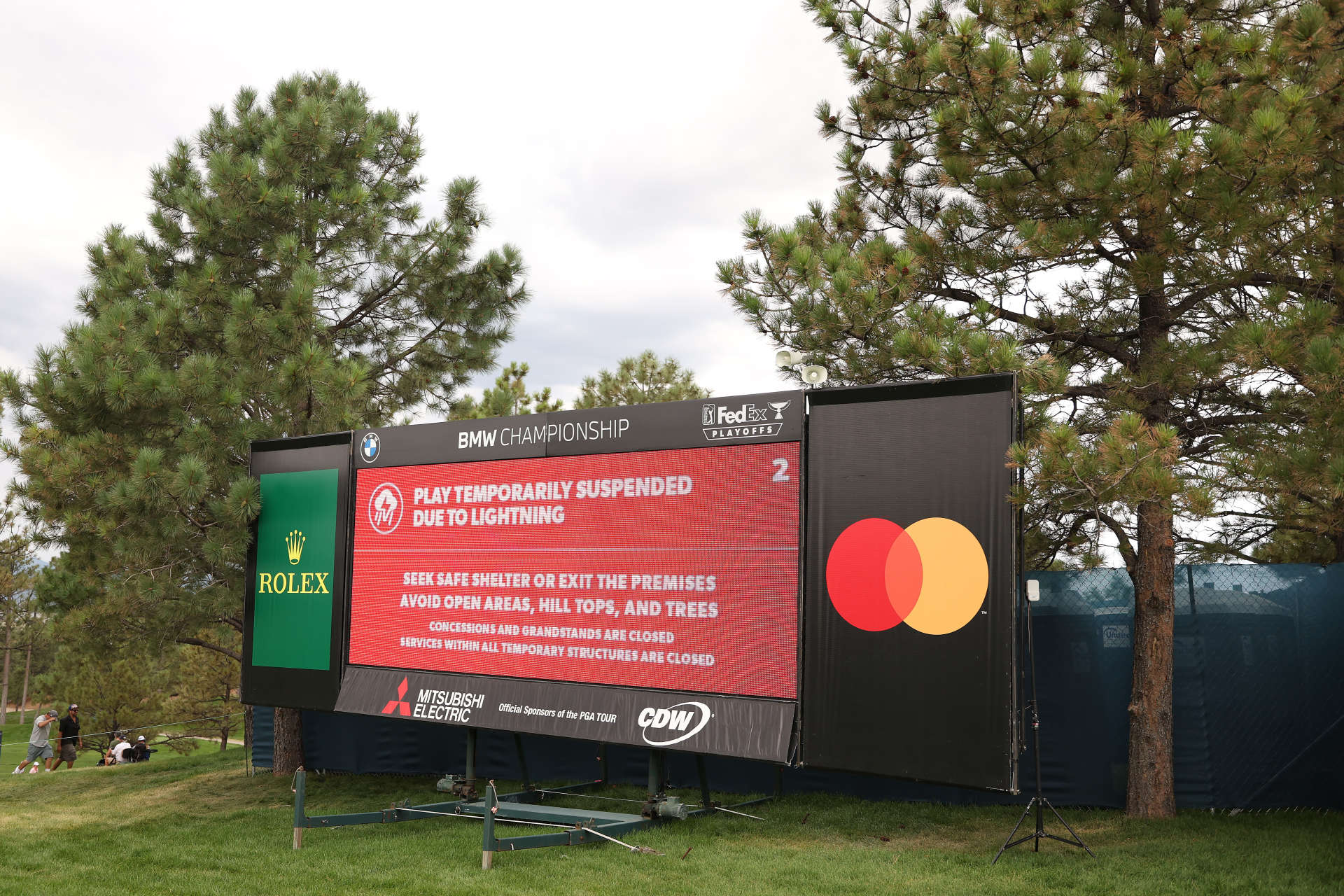 CASTLE ROCK, COLORADO - AUGUST 22: Signage showing that play has been suspended due to lighting in the area during the first round of the BMW Championship at Castle Pines Golf Club on August 22, 2024 in Castle Rock, Colorado. (Photo by Christian Petersen/Getty Images)