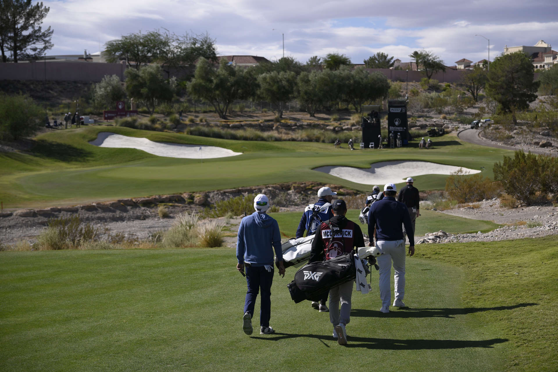 LAS VEGAS, NEVADA - OCTOBER 19: Norman Xiong, Ryan McCormick and Dan McCarthy of the United States walk on the fifth hole during the second round of the Shriners Children's Open 2024 at TPC Summerlin on October 19, 2024 in Las Vegas, Nevada. (Photo by Orlando Ramirez/Getty Images)