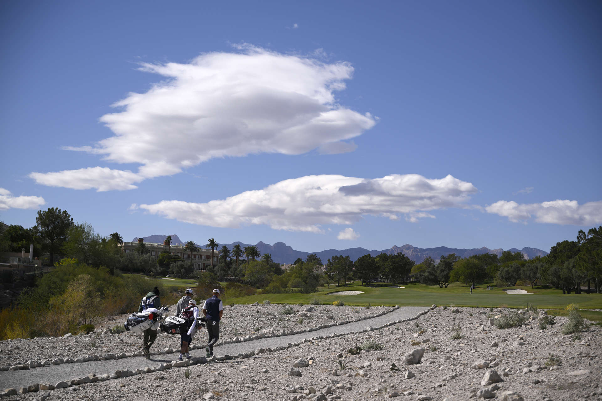 LAS VEGAS, NEVADA - OCTOBER 18: (L-R) Patton Kizzire of the United States and Erik van Rooyen of South Africa walk on the third hole during the second round of the Shriners Children's Open 2024 at TPC Summerlin on October 18, 2024 in Las Vegas, Nevada. (Photo by Orlando Ramirez/Getty Images)