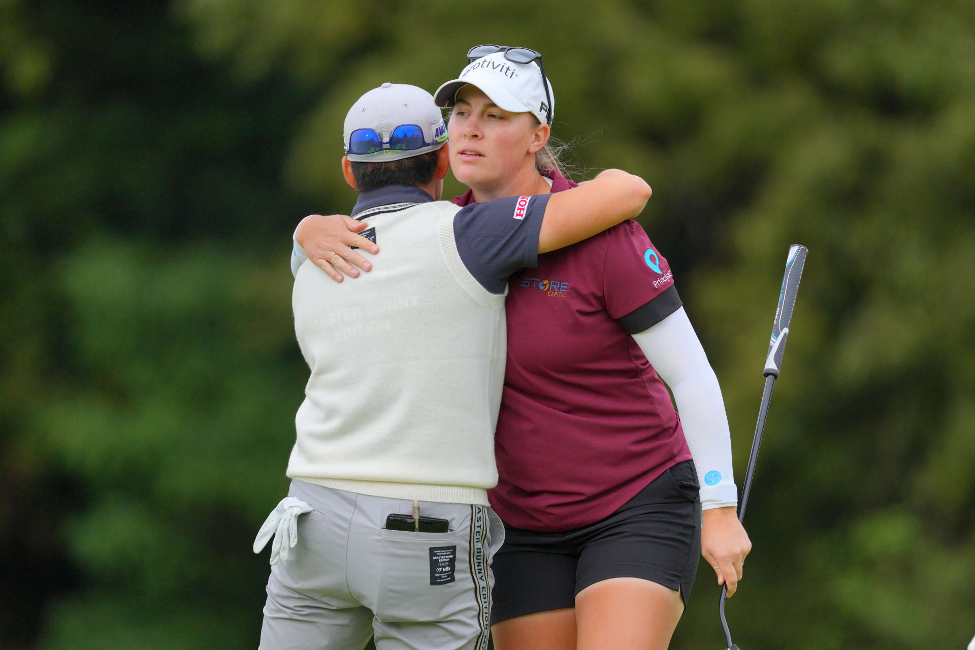 OTSU, JAPAN - OCTOBER 31: Akie Iwai (L) of Japan and Jennifer Kupcho (R) of the United States embrace after holing out on the 18th green during the first round of the TOTO Japan Classic 2024 at Seta Golf Course on October 31, 2024 in Otsu, Shiga, Japan. (Photo by Yoshimasa Nakano/Getty Images)