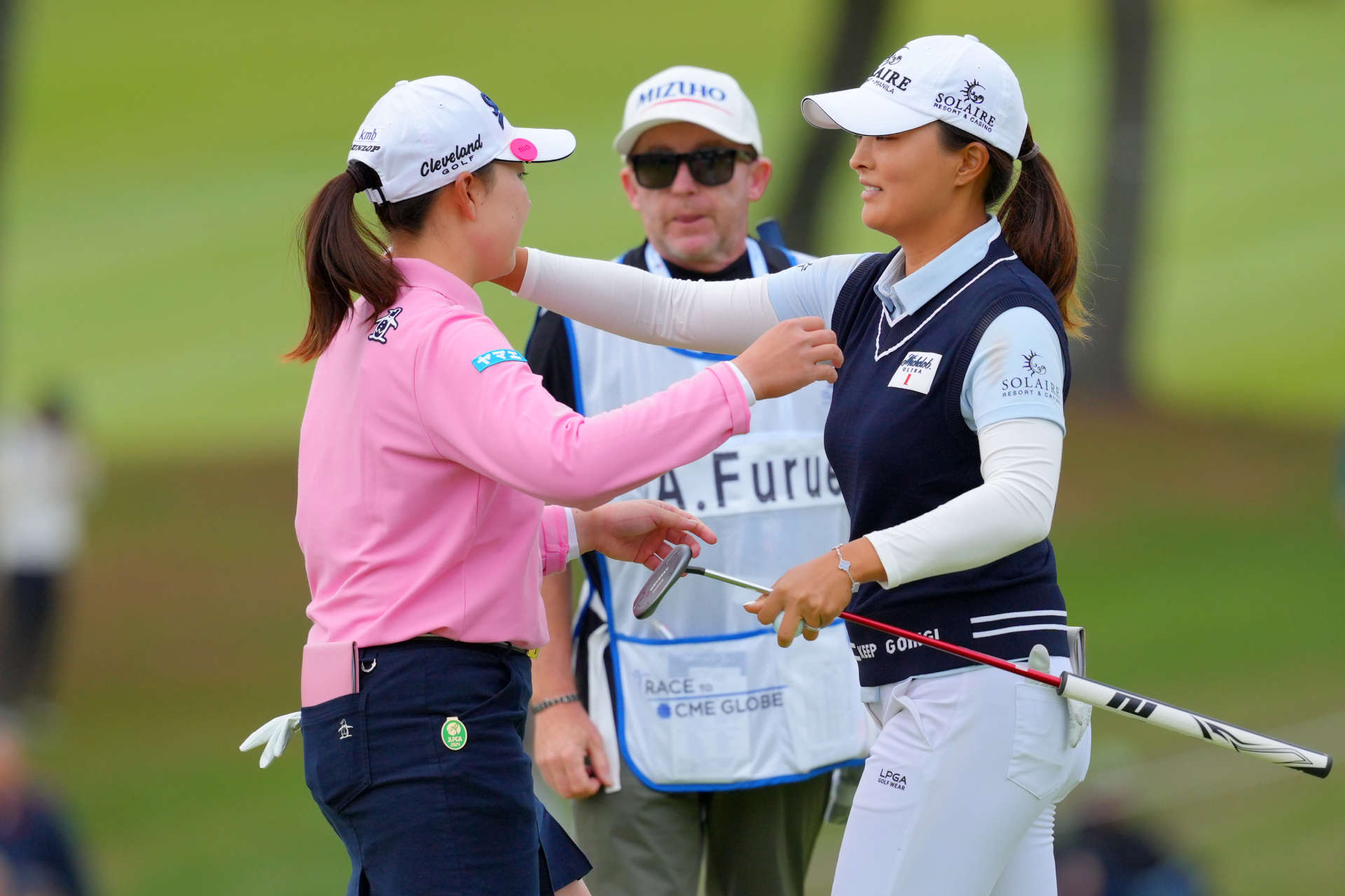 OTSU, JAPAN - OCTOBER 31: Rio Takeda (L) of Japan and Jin Young Ko (R) of South Korea embrace after holing out 1during the first round of the TOTO Japan Classic 2024 at Seta Golf Course on October 31, 2024 in Otsu, Shiga, Japan. (Photo by Yoshimasa Nakano/Getty Images)