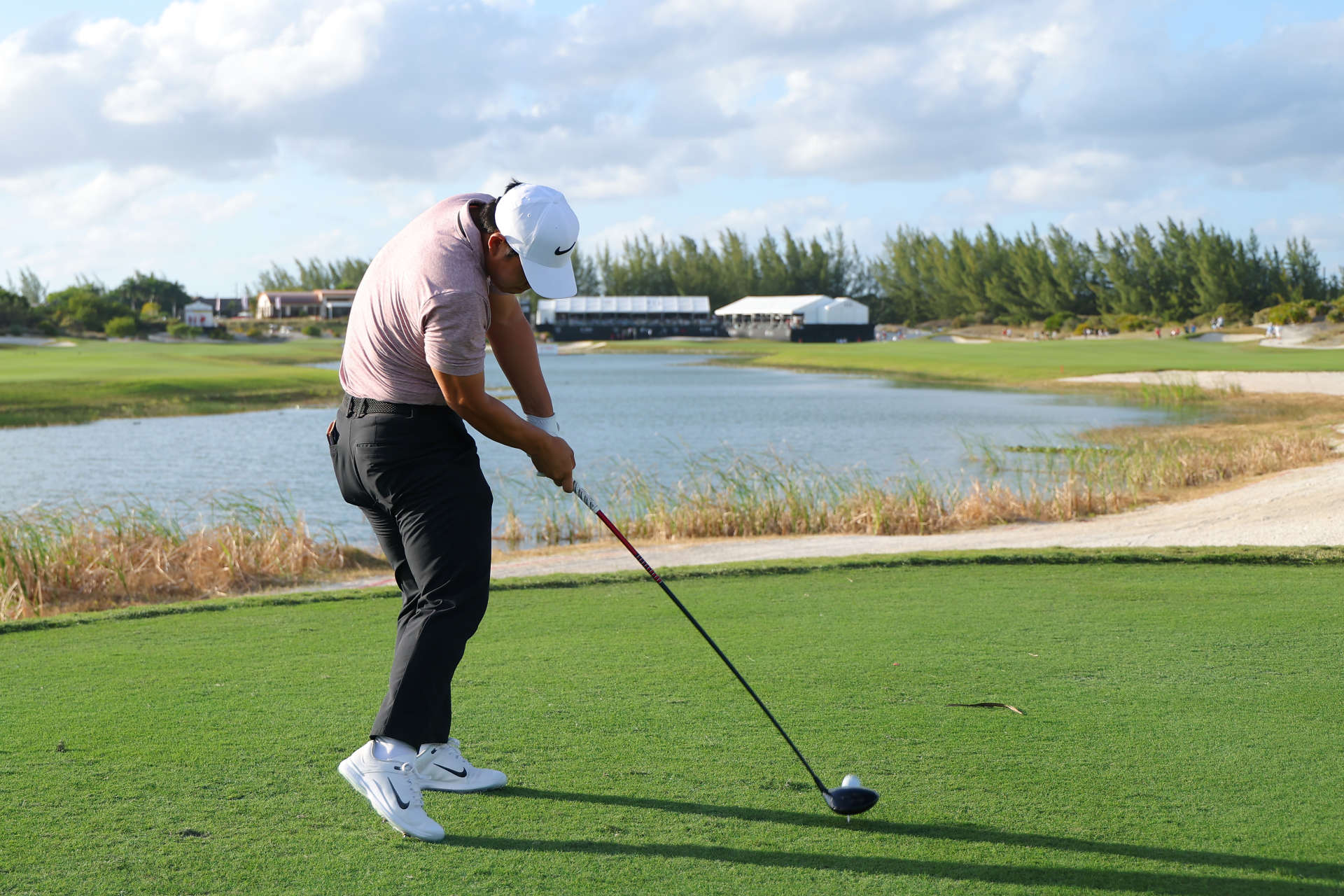 NASSAU, BAHAMAS - DECEMBER 07: Tom Kim of South Korea plays his shot from the 18th tee during the third round of the Hero World Challenge 2024 at Albany Golf Course on December 07, 2024 in Nassau, Bahamas. (Photo by Kevin C. Cox/Getty Images)