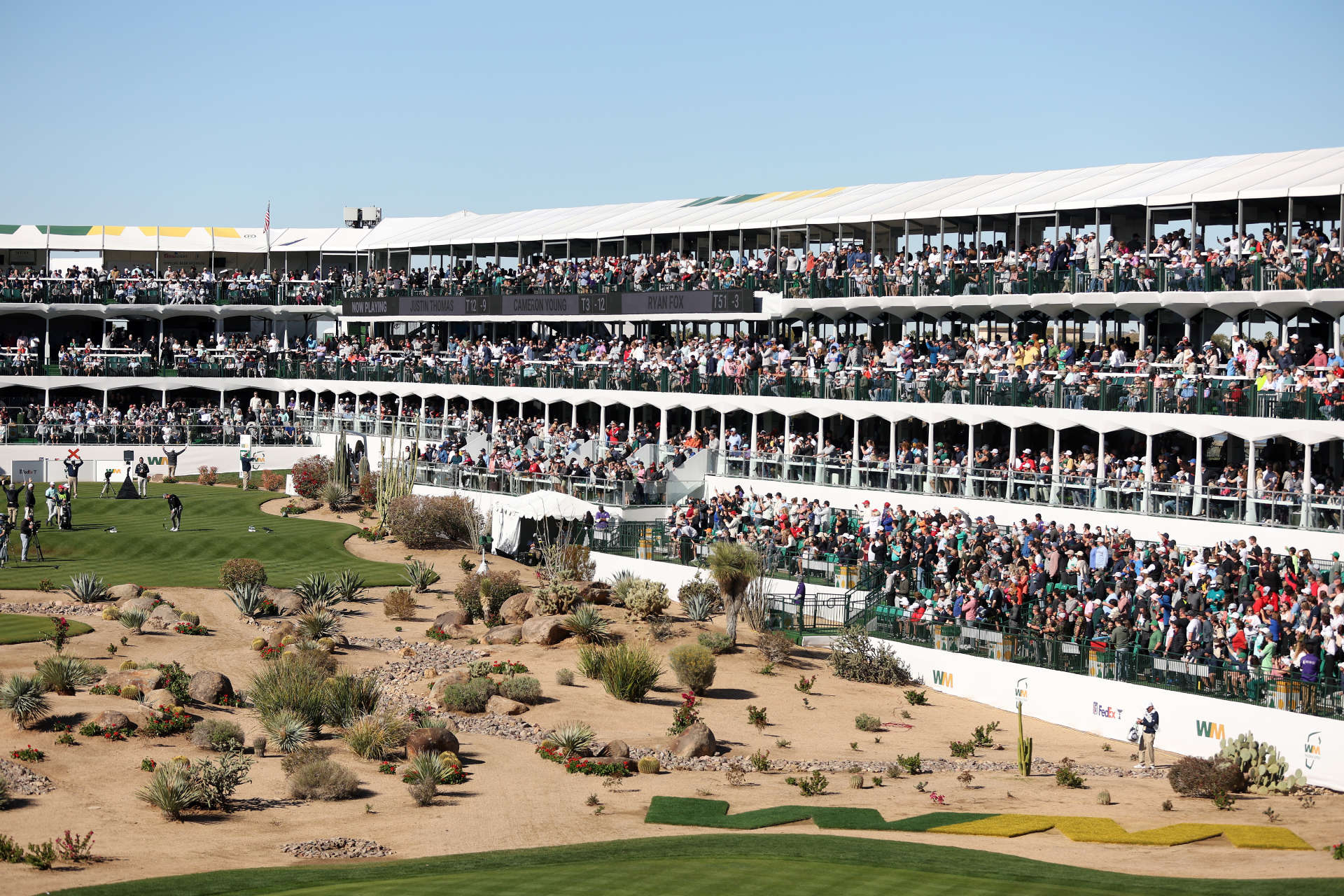 SCOTTSDALE, ARIZONA - FEBRUARY 11: Justin Thomas of the United States plays his shot from the 16th tee as fans look on during the continuation of the third round of the WM Phoenix Open at TPC Scottsdale on February 11, 2024 in Scottsdale, Arizona. (Photo by Christian Petersen/Getty Images)