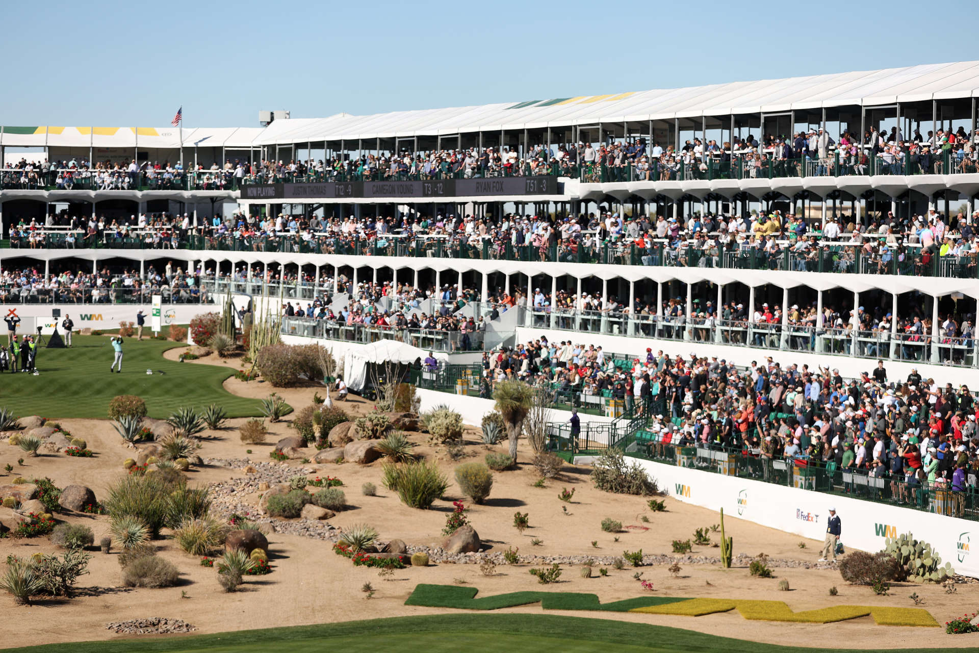 SCOTTSDALE, ARIZONA - FEBRUARY 11: Cameron Young of the United States plays his shot from the 16th tee as fans look on during the continuation of the third round of the WM Phoenix Open at TPC Scottsdale on February 11, 2024 in Scottsdale, Arizona. (Photo by Christian Petersen/Getty Images)