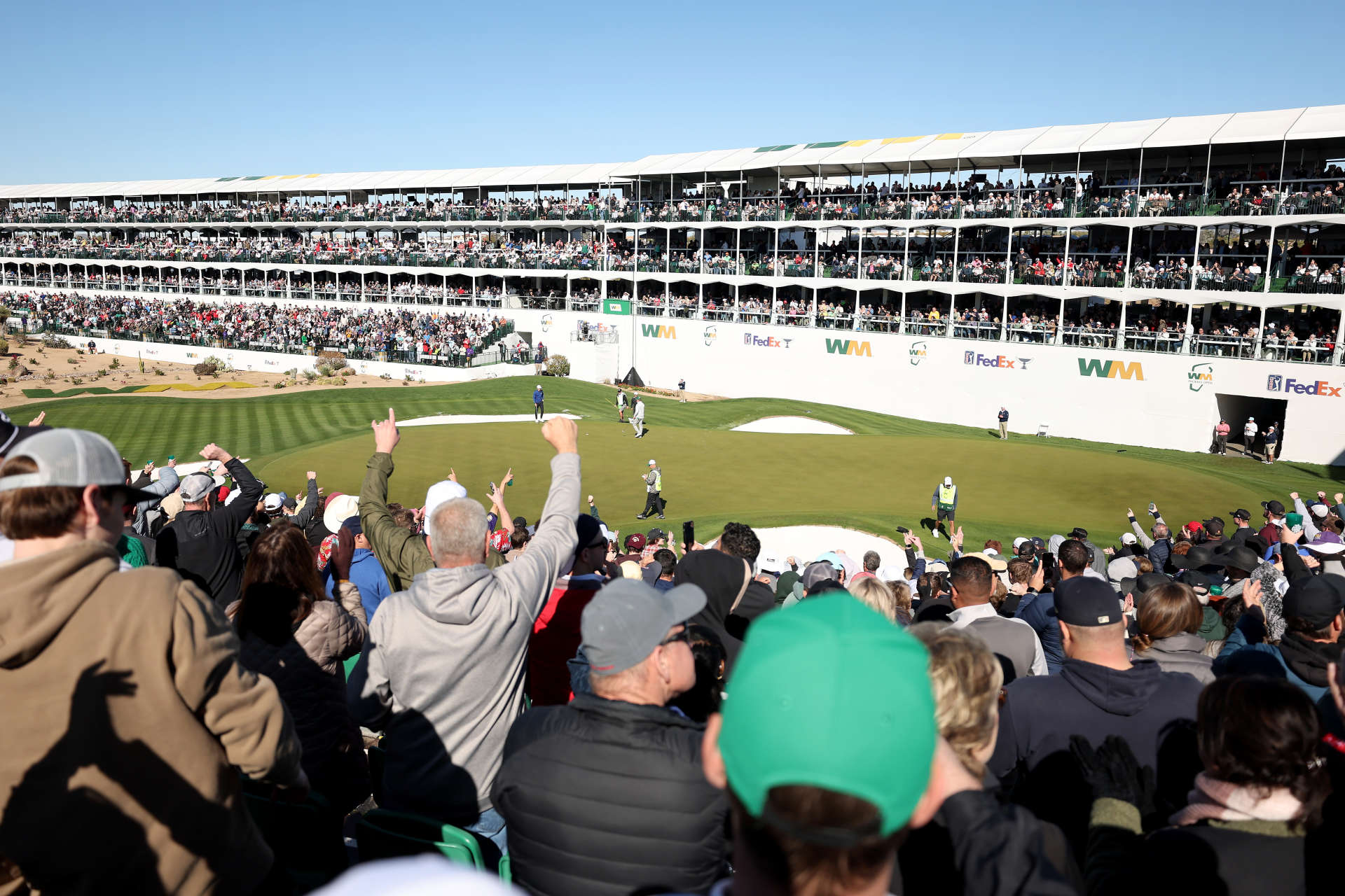 SCOTTSDALE, ARIZONA - FEBRUARY 11: A general view is seen as fans cheer for Charley Hoffman of the United States and Jordan Spieth of the United Stateson the 16th hole during the continuation of the third round of the WM Phoenix Open at TPC Scottsdale on February 11, 2024 in Scottsdale, Arizona. (Photo by Christian Petersen/Getty Images)