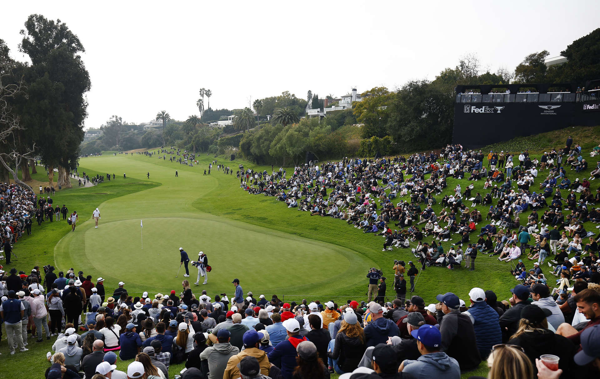 PACIFIC PALISADES, CALIFORNIA - FEBRUARY 17: Tommy Fleetwood of England finishes his round on the 18th green during the third round of The Genesis Invitational at Riviera Country Club on February 17, 2024 in Pacific Palisades, California. (Photo by Ronald Martinez/Getty Images)