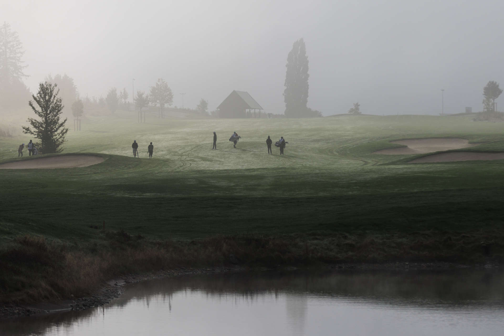 FOLGENSBOURG, FRANCE - SEPTEMBER 29: Players return to the clubhouse after the tournament was suspended due to fog on day four of the Swiss Challenge 2024 at Golf Saint Apollinaire on September 29, 2024 in Folgensbourg, France. (Photo by Jan Hetfleisch/Getty Images)