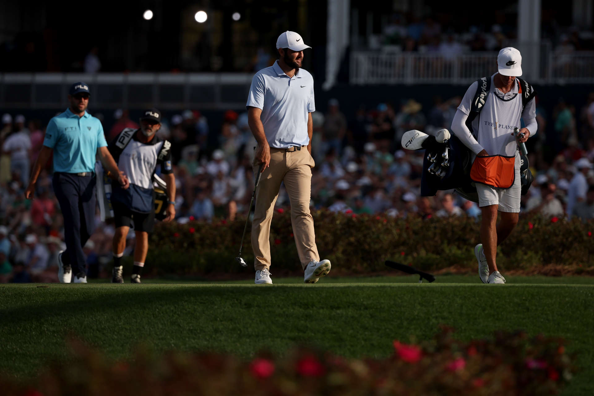 PONTE VEDRA BEACH, FLORIDA - MARCH 16: Scottie Scheffler of the United States and Corey Conners of Canada walks on the 17th hole during the third round of THE PLAYERS Championship at TPC Sawgrass on March 16, 2024 in Ponte Vedra Beach, Florida. (Photo by Jared C. Tilton/Getty Images)