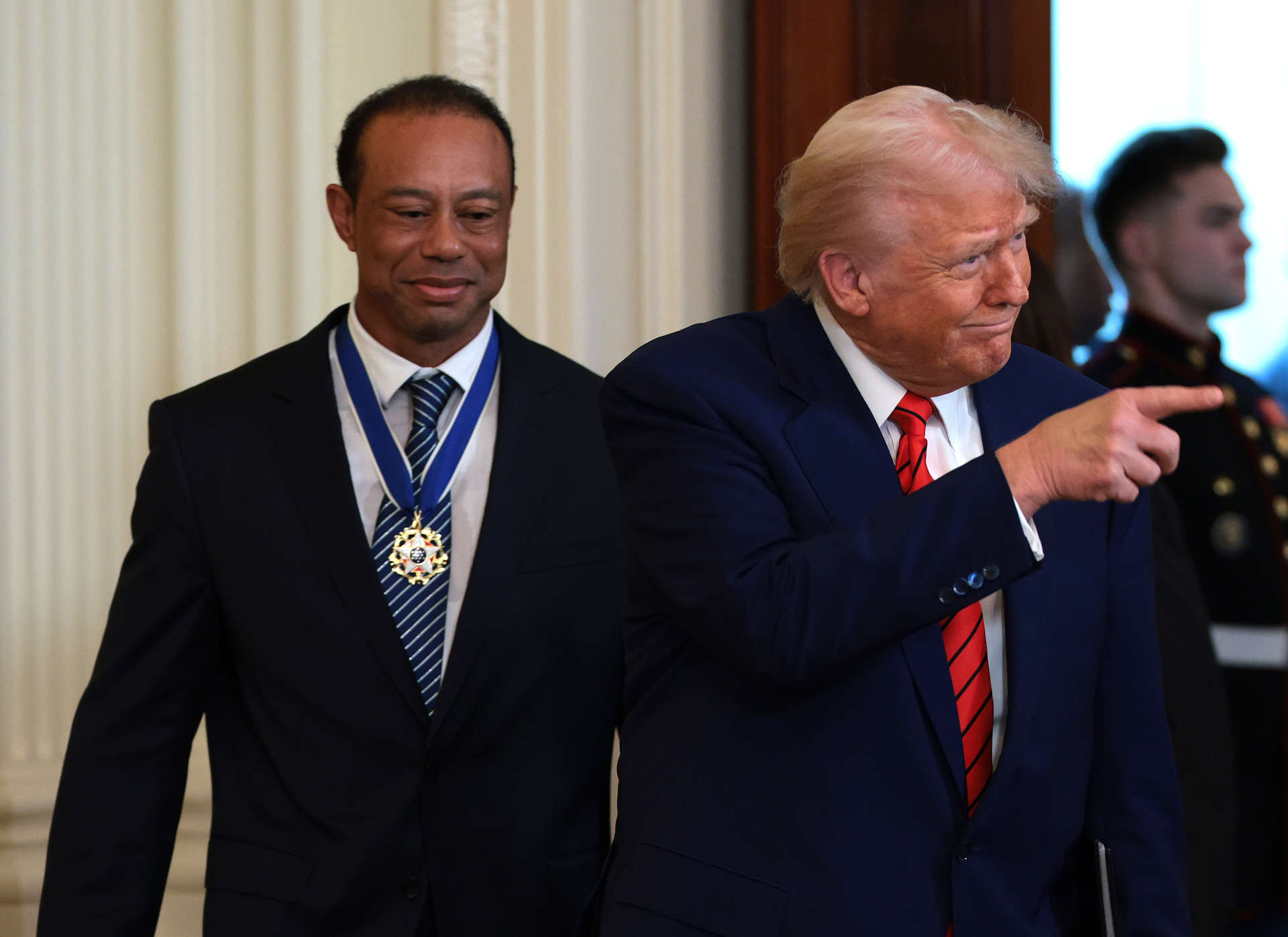 WASHINGTON, DC - FEBRUARY 20: U.S. President Donald Trump and golf legend Tiger Woods arrive for a reception honoring Black History Month in the East Room of the White House on February 20, 2025 in Washington, DC. The Black History Month celebration comes as Trump has signed a series of executive orders ending federal diversity, equity and inclusion (DEI) programs and cutting funding to schools and Universities that do not cut DEI programs. (Photo by Win McNamee/Getty Images)