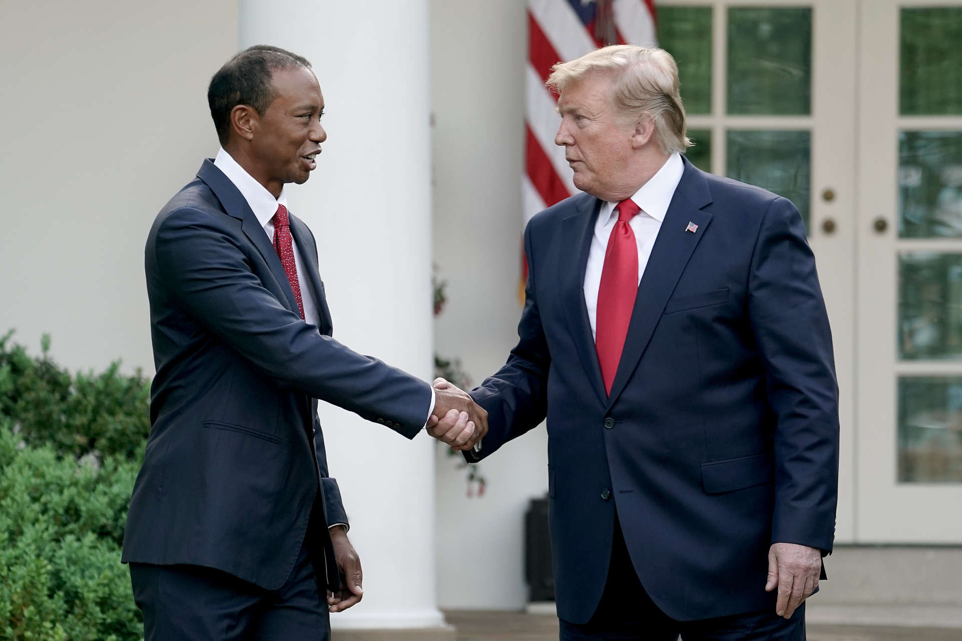 WASHINGTON, DC - MAY 06: U.S. President Donald Trump gives professional golfer and business partner Tiger Woods the Medal of Freedom during a ceremony in the Rose Garden at the White House May 06, 2019 in Washington, DC. Trump announced he would give the nation’s highest civilian honor to Woods, 43, in honor of his Masters victory last month. (Photo by Chip Somodevilla/Getty Images)