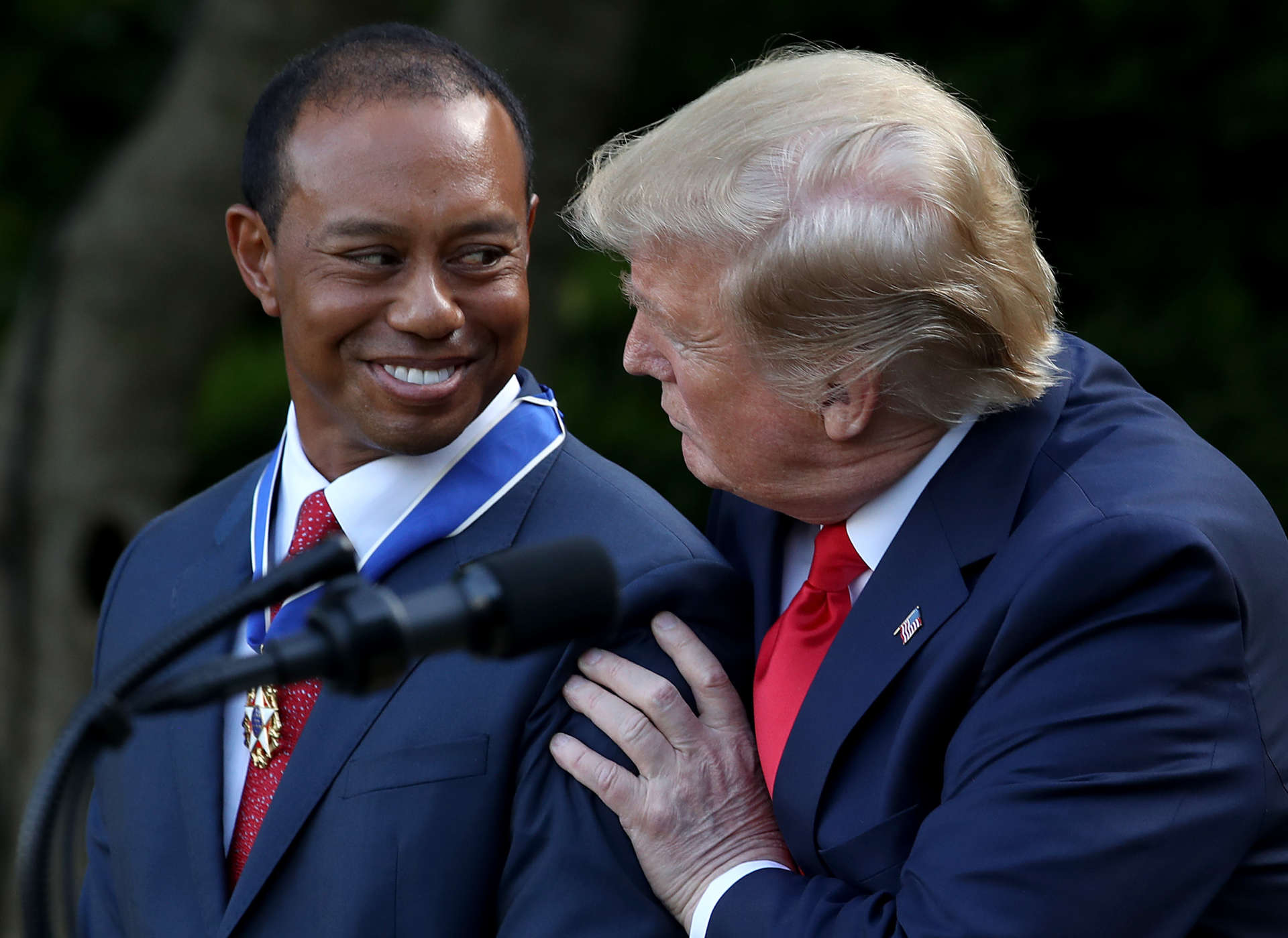 WASHINGTON, DC - MAY 06: U.S. President Donald Trump presents professional golfer and business partner Tiger Woods with the Medal of Freedom during a ceremony in the Rose Garden at the White House May 06, 2019 in Washington, DC. Trump announced he would give the nation’s highest civilian honor to Woods, 43, in honor of his Masters victory last month. (Photo by Win McNamee/Getty Images)