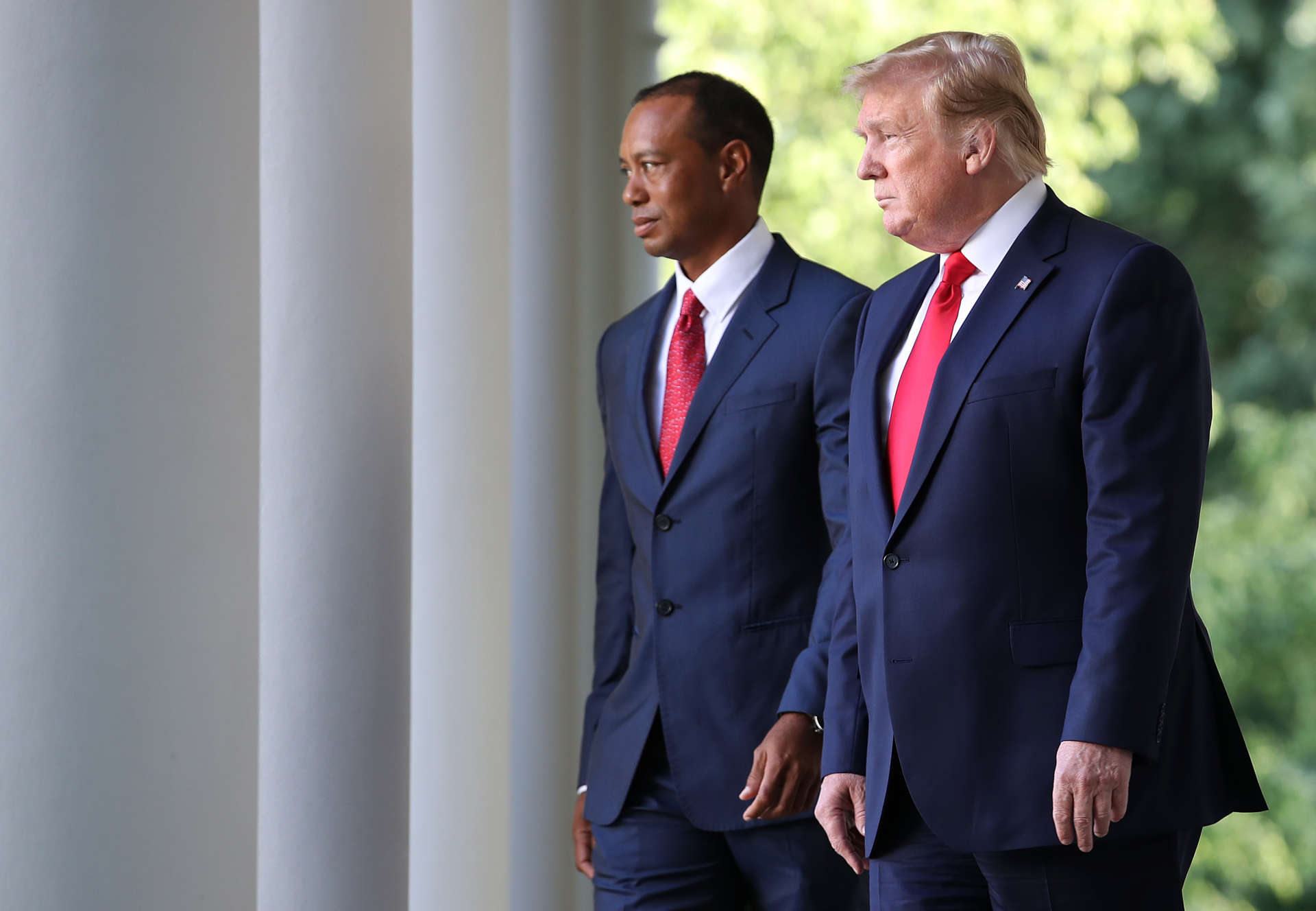 WASHINGTON, DC - MAY 06: U.S. President Donald Trump walks to the Rose Garden with professional golfer and business partner Tiger Woods before Woods was presented with the Medal of Freedom during a ceremony in the Rose Garden at the White House May 06, 2019 in Washington, DC. Trump announced he would give the nation’s highest civilian honor to Woods, 43, in honor of his Masters victory last month. (Photo by Win McNamee/Getty Images)