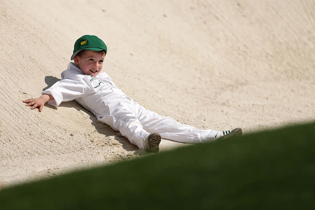AUGUSTA, GEORGIA - APRIL 09: Son of Nick Taylor of Canada, Charlie Taylor, plays in a bunker during the Par Three Contest prior to the 2025 Masters Tournament at Augusta National Golf Club on April 09, 2025 in Augusta, Georgia. (Photo by Richard Heathcote/Getty Images)