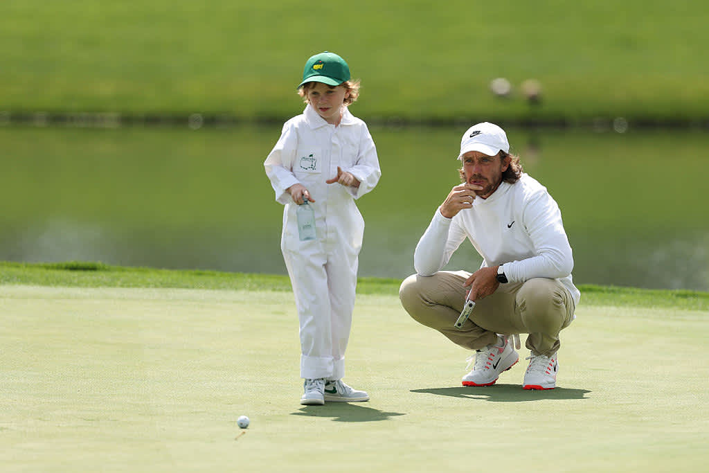 AUGUSTA, GEORGIA - APRIL 09: Tommy Fleetwood of England 
interacts with his son, Franklin Fleetwood during the Par Three Contest prior to the 2025 Masters Tournament at Augusta National Golf Club on April 09, 2025 in Augusta, Georgia. (Photo by Richard Heathcote/Getty Images)