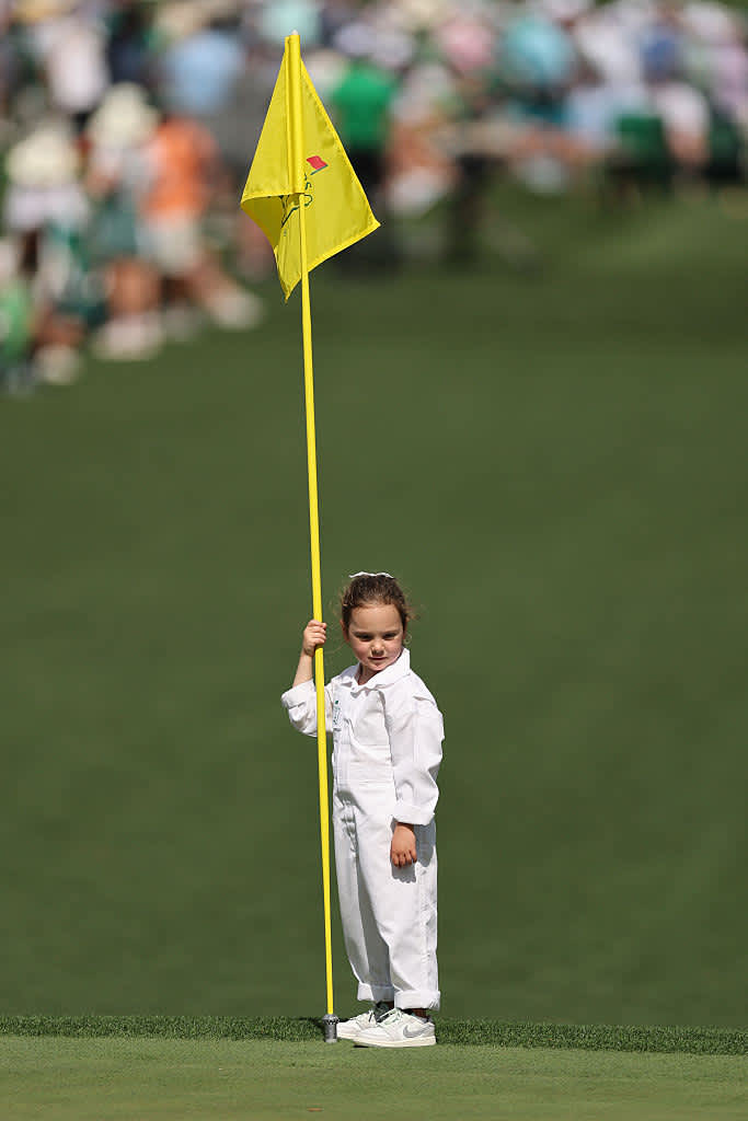 AUGUSTA, GEORGIA - APRIL 09: Daughter of Rory McIlroy of Northern Ireland, Poppy McIlroy, holds a pin flag during the Par Three Contest prior to the 2025 Masters Tournament at Augusta National Golf Club on April 09, 2025 in Augusta, Georgia. (Photo by Michael Reaves/Getty Images)