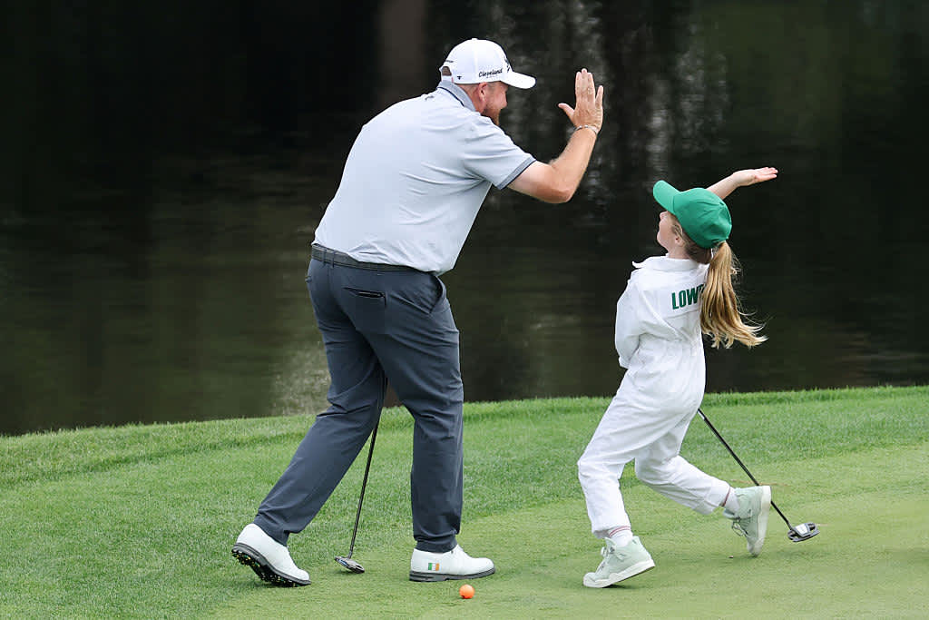 AUGUSTA, GEORGIA - APRIL 09: Shane Lowry of Ireland high fives his daughter, Iris Lowry on the ninth green during the Par Three Contest prior to the 2025 Masters Tournament at Augusta National Golf Club on April 09, 2025 in Augusta, Georgia. (Photo by Michael Reaves/Getty Images)