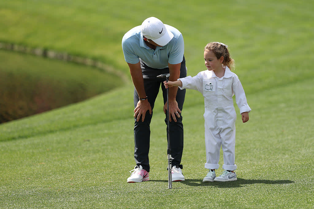 AUGUSTA, GEORGIA - APRIL 09: Rory McIlroy of Northern Ireland 
speaks with his daughter, Poppy McIlroy during the Par Three Contest prior to the 2025 Masters Tournament at Augusta National Golf Club on April 09, 2025 in Augusta, Georgia. (Photo by Richard Heathcote/Getty Images)