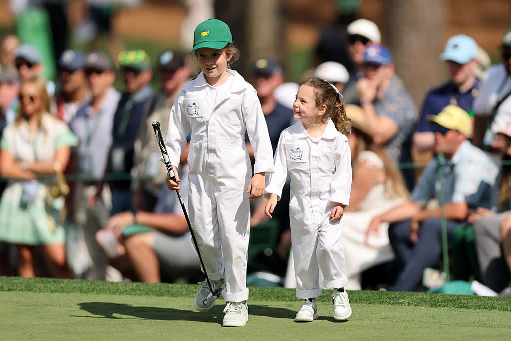 AUGUSTA, GEORGIA - APRIL 09: Daughter of Shane Lowry of Ireland, Iris Lowry and daughter of Rory McIlroy of Northern Ireland, Poppy McIlroy, smile during the Par Three Contest prior to the 2025 Masters Tournament at Augusta National Golf Club on April 09, 2025 in Augusta, Georgia. (Photo by Michael Reaves/Getty Images)