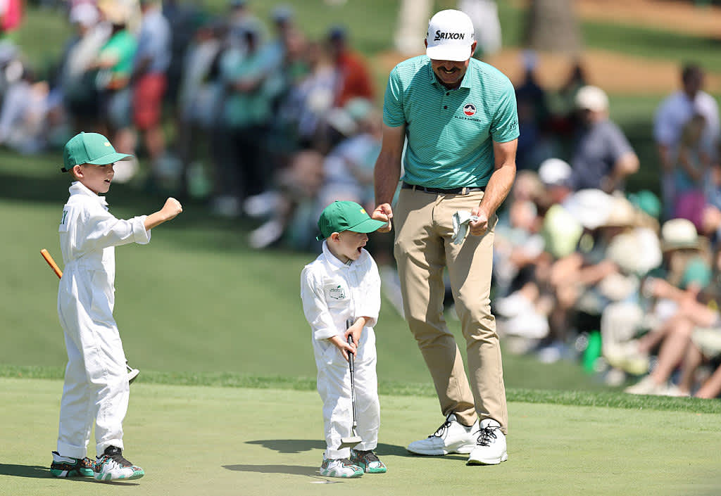 AUGUSTA, GEORGIA - APRIL 09: Keegan Bradley of the United States and his children, Logan and Cooper, react to a putt on the seventh green during the Par Three Contest prior to the 2025 Masters Tournament at Augusta National Golf Club on April 09, 2025 in Augusta, Georgia. (Photo by Michael Reaves/Getty Images)