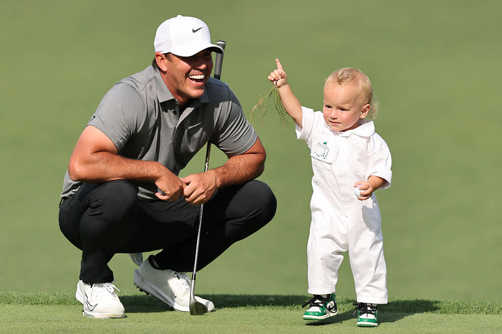 AUGUSTA, GEORGIA - APRIL 09: Brooks Koepka of the United States watches his child Crew reactduring the Par Three Contest prior to the 2025 Masters Tournament at Augusta National Golf Club on April 09, 2025 in Augusta, Georgia. (Photo by Michael Reaves/Getty Images)