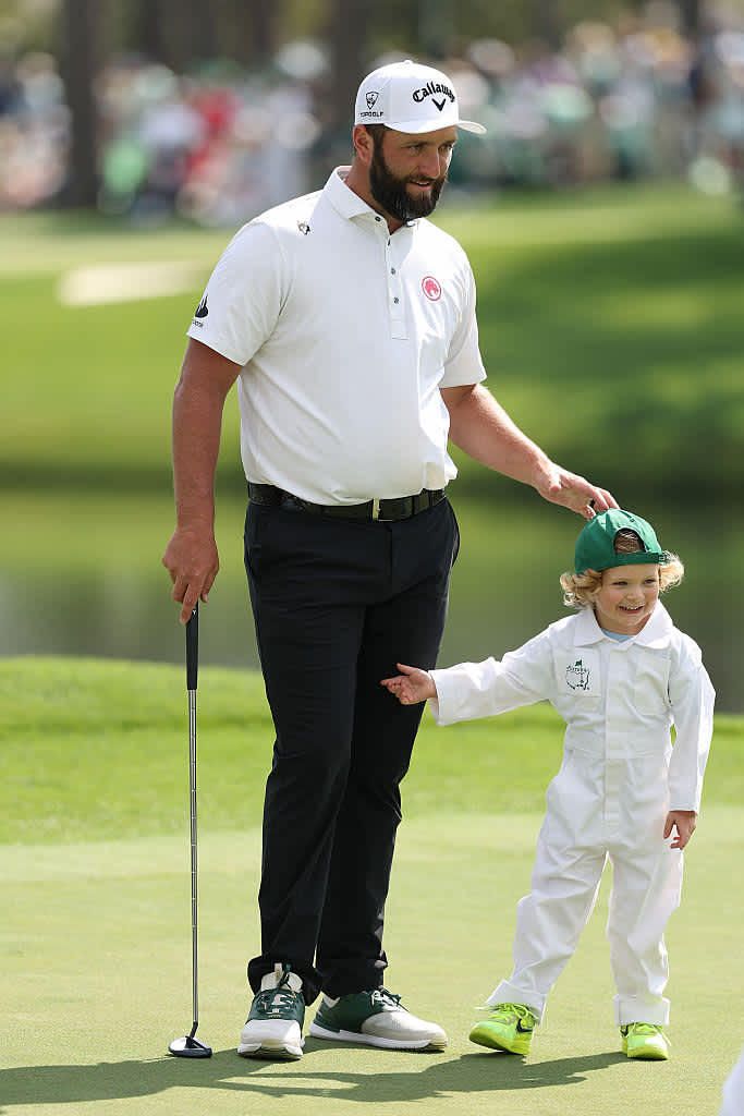 AUGUSTA, GEORGIA - APRIL 09: Jon Rahm of Spain interacts with his son, Kepa Rahm, during the Par Three Contest prior to the 2025 Masters Tournament at Augusta National Golf Club on April 09, 2025 in Augusta, Georgia. (Photo by Richard Heathcote/Getty Images)