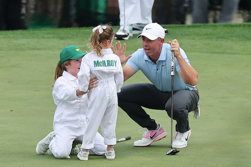AUGUSTA, GEORGIA - APRIL 09: Rory McIlroy of Northern Ireland 
celebrates a putt by his daughter, Poppy McIlroy, on the ninth green during the Par Three Contest prior to the 2025 Masters Tournament at Augusta National Golf Club on April 09, 2025 in Augusta, Georgia. (Photo by Michael Reaves/Getty Images)