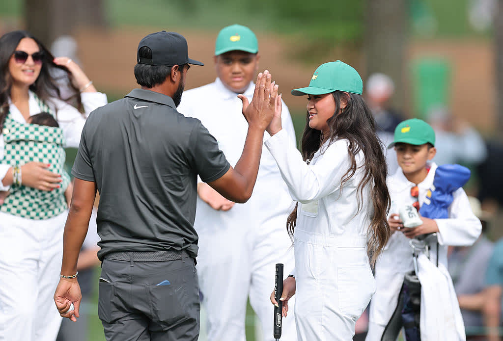 AUGUSTA, GEORGIA - APRIL 09: Tony Finau of the United States high-fives his daughter during the Par Three Contest prior to the 2025 Masters Tournament at Augusta National Golf Club on April 09, 2025 in Augusta, Georgia. (Photo by Michael Reaves/Getty Images)