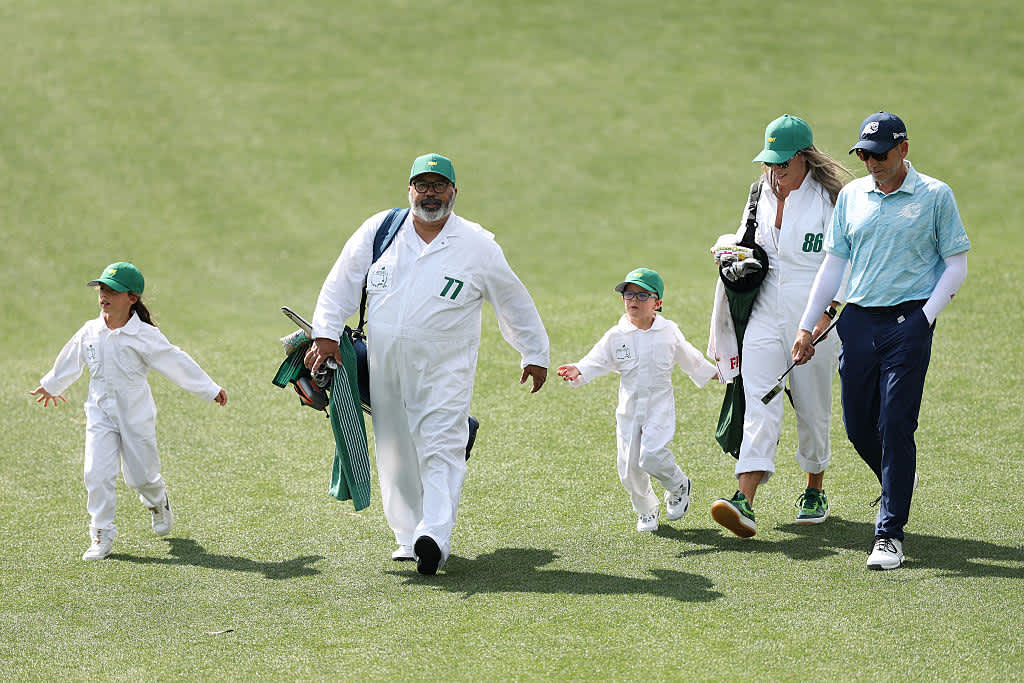 AUGUSTA, GEORGIA - APRIL 09: Caddie of Patrick Reed of the United States, Michael Collins, ESPN Golf Reporter & Analyst walks with Sergio Garcia of Spain and his family during the Par Three Contest prior to the 2025 Masters Tournament at Augusta National Golf Club on April 09, 2025 in Augusta, Georgia. (Photo by Richard Heathcote/Getty Images)