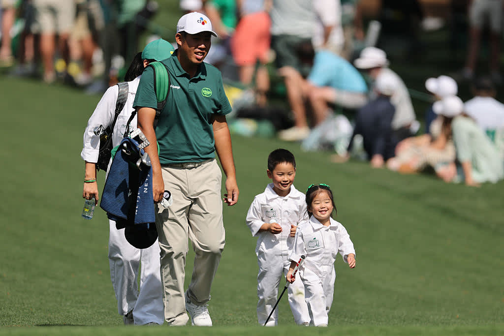 AUGUSTA, GEORGIA - APRIL 09: Byeong Hun An of Korea walks with his children, An Ji-woo and An Sun-woo during the Par Three Contest prior to the 2025 Masters Tournament at Augusta National Golf Club on April 09, 2025 in Augusta, Georgia. (Photo by Michael Reaves/Getty Images)