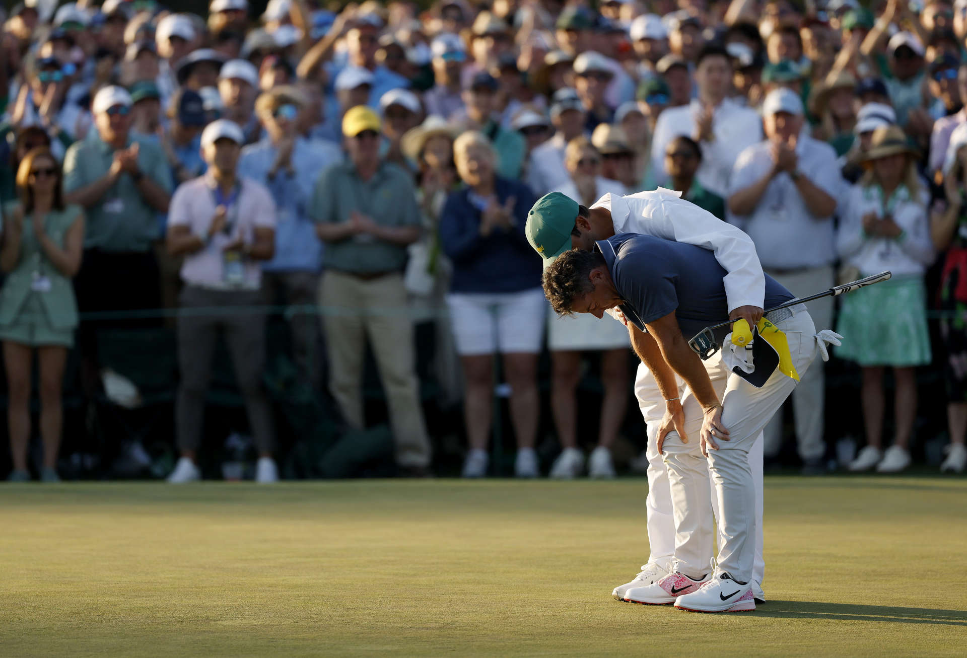 AUGUSTA, GEORGIA - APRIL 13: Rory McIlroy of Northern Ireland celebrates after putting for a birdie during the first playoff hole and winning the final round of the 2025 Masters Tournament at Augusta National Golf Club on April 13, 2025 in Augusta, Georgia. (Photo by Harry How/Getty Images)