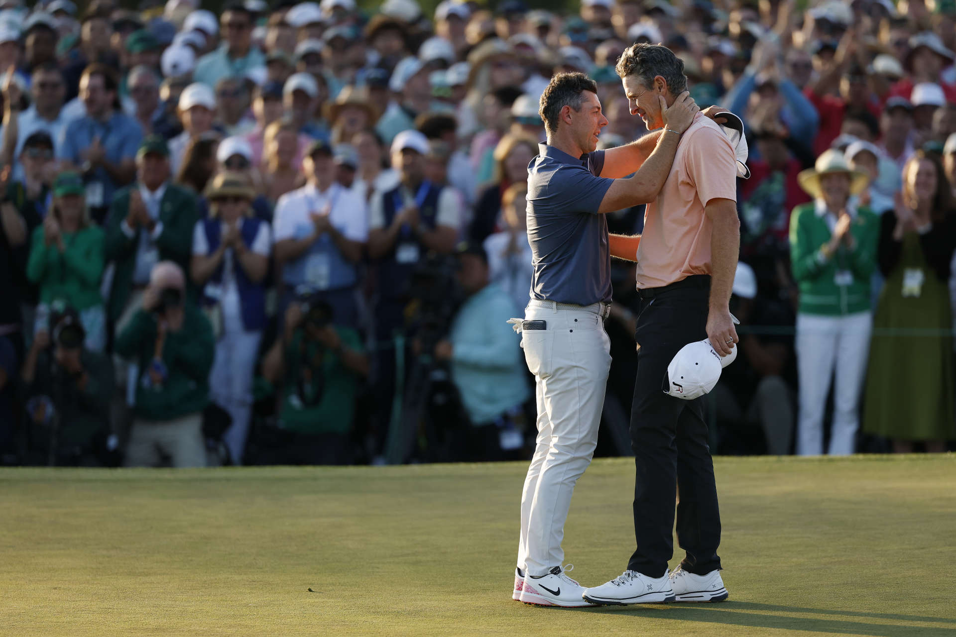 AUGUSTA, GEORGIA - APRIL 13: (L-R) Rory McIlroy of Northern Ireland shakes hands with Justin Rose of England after the first playoff hole during the final round of the 2025 Masters Tournament at Augusta National Golf Club on April 13, 2025 in Augusta, Georgia. (Photo by Harry How/Getty Images)