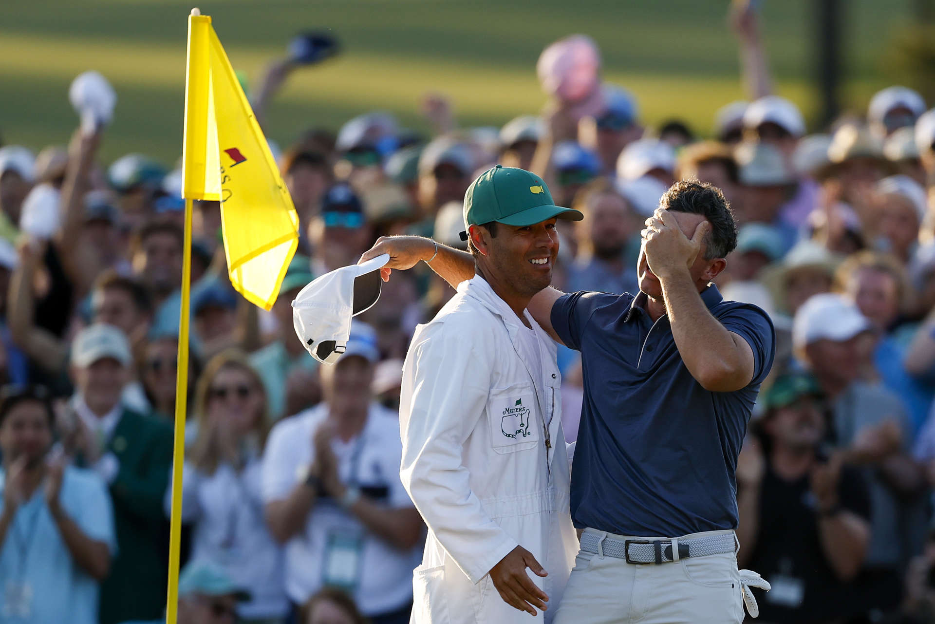AUGUSTA, GEORGIA - APRIL 13: (R-L) Rory McIlroy of Northern Ireland celebrates winning with caddie Harry Diamond after the playoff hole during the final round of the 2025 Masters Tournament at Augusta National Golf Club on April 13, 2025 in Augusta, Georgia. (Photo by Harry How/Getty Images)