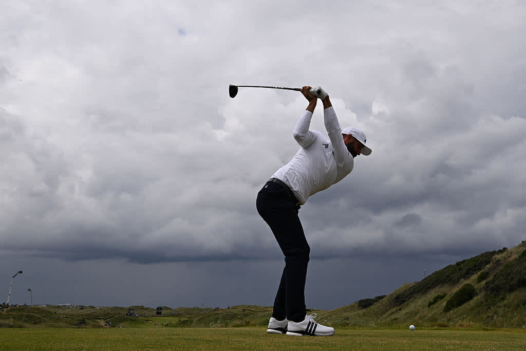 US golfer Dustin Johnson plays from the 7th tee on day two of the 153rd Open Championship at Royal Portrush golf club in Northern Ireland on July 18, 2025. (Photo by Glyn KIRK / AFP) / RESTRICTED TO EDITORIAL USE (Photo by GLYN KIRK/AFP via Getty Images)