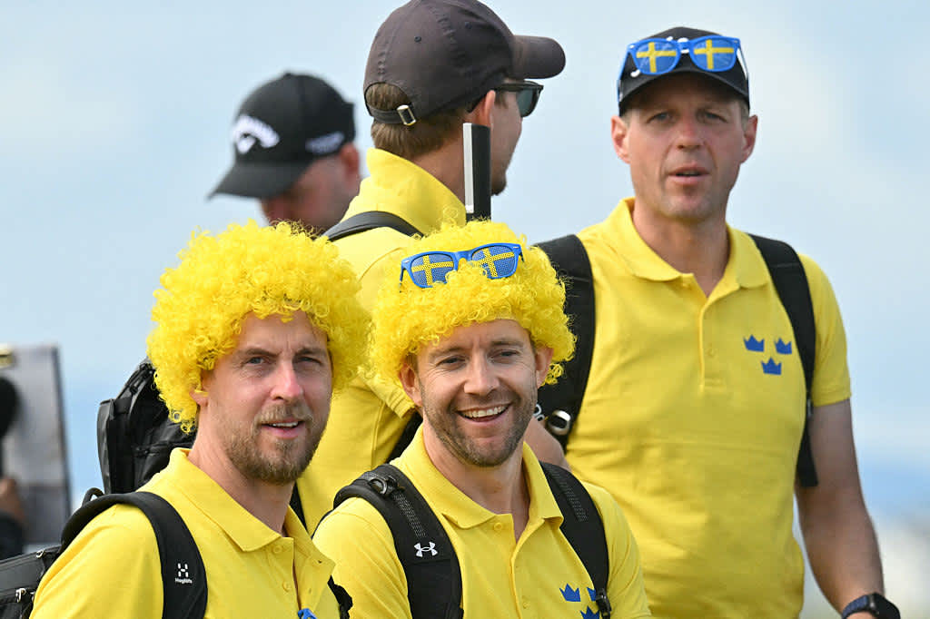 Swedish golf fans out on the course on day two of the 153rd Open Championship at Royal Portrush golf club in Northern Ireland on July 18, 2025. (Photo by ANDY BUCHANAN / AFP) / RESTRICTED TO EDITORIAL USE (Photo by ANDY BUCHANAN/AFP via Getty Images)