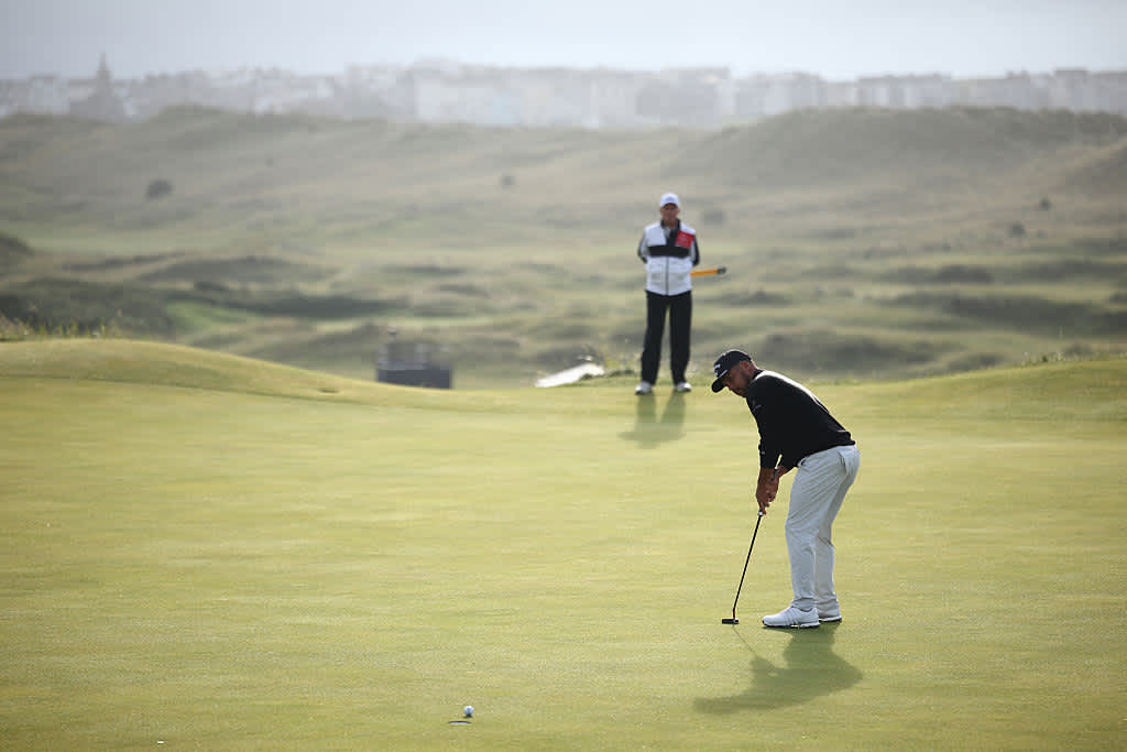 US golfer Xander Schauffele putts on the 16th green on day two of the 153rd Open Championship at Royal Portrush golf club in Northern Ireland on July 18, 2025. (Photo by HENRY NICHOLLS / AFP) / RESTRICTED TO EDITORIAL USE (Photo by HENRY NICHOLLS/AFP via Getty Images)