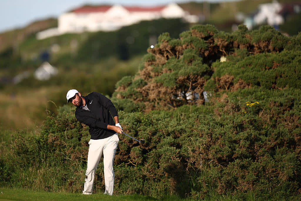 US golfer Scottie Scheffler plays from off the fairway on the 17th hole on day three of the 153rd Open Championship at Royal Portrush golf club in Northern Ireland on July 19, 2025. (Photo by HENRY NICHOLLS / AFP) / RESTRICTED TO EDITORIAL USE (Photo by HENRY NICHOLLS/AFP via Getty Images)