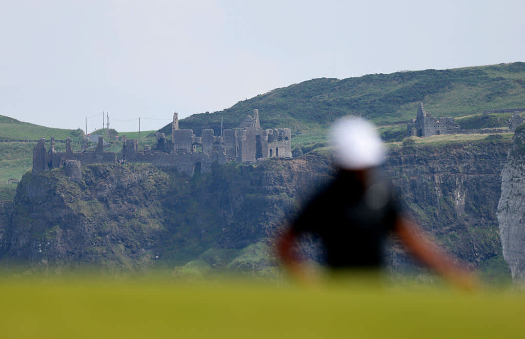PORTRUSH, NORTHERN IRELAND - JULY 20: Dunluce Castle is seen as Tony Finau of the United States prepares to putt on the fifth green during day four of The 153rd Open Championship at Royal Portrush Golf Club on July 20, 2025 in Portrush, Northern Ireland. (Photo by Christian Petersen/Getty Images)